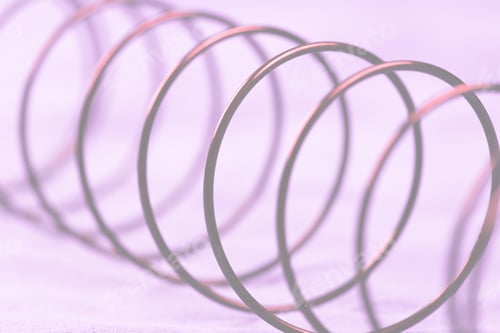 Preview: Details Of A Metal Spring On Pink Cloth.