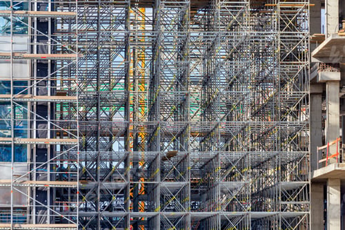 Preview: Scaffolding For Installation Of Glass Facade Panels To A New Building Background. Selective Focus.