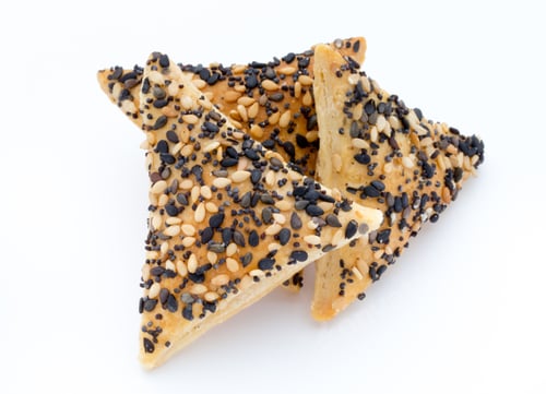 Preview: Crisps With Nuts And Seeds Stacked On A White Background.