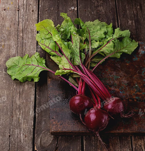 Preview: Beetroot With Leaves Over A Rustic Wooden Board