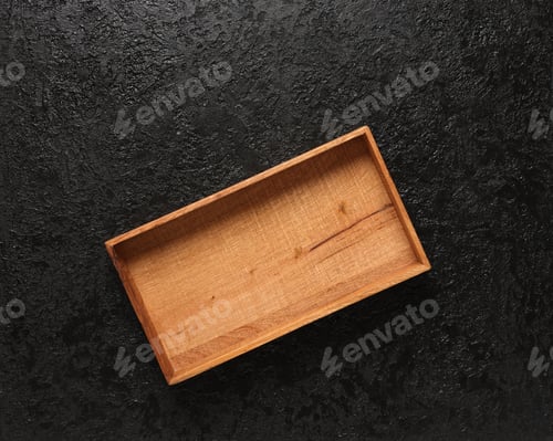 Preview: Top View Of A Wooden Box Or Storage Box Lies On A Beautiful Black Background With The Texture Of