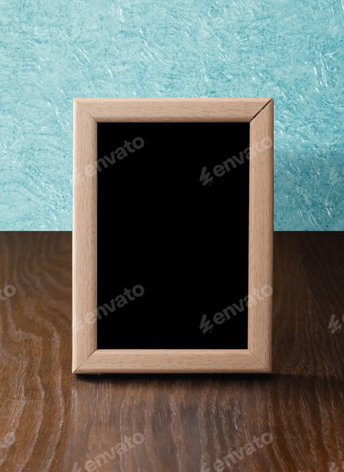 Preview: Wooden Photo Frame On Table, Blue Wall