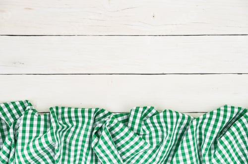 Preview: Green Tablecloth On White Background With Copy Space.