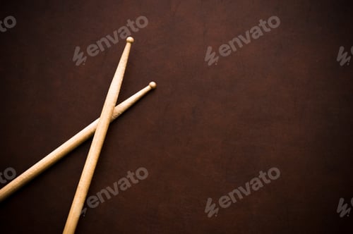Preview: Couple Of Drum Sticks On Wooden Desktop Background