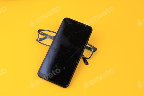 Preview: Broken Glasses And Smartphone. Selective Focus. Background