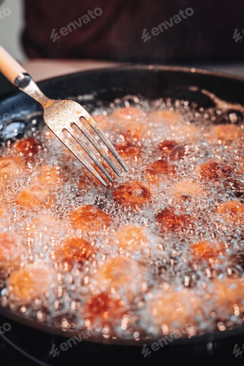 Preview: Frying Home Made Italian Traditional Meatballs With Parmesan And Bread