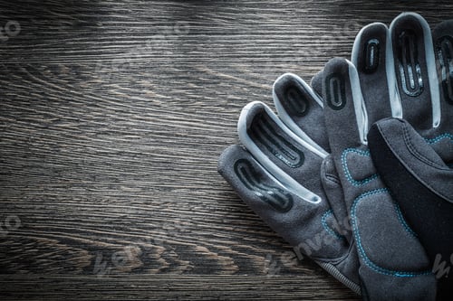 Preview: Pair Of Protective Gloves On Wooden Board.