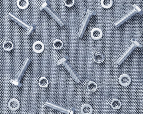 Preview: Top View Of Many Bolts, Nuts And Washers On A Steel Mesh. Industrial Concept Image.