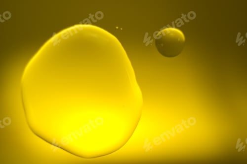 Preview: Yellow Cooking Oil Bubble And Drops On Water For Background.