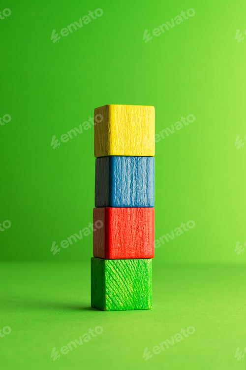 Preview: Colorful Wooden Cubes Stacked Over Green, Background