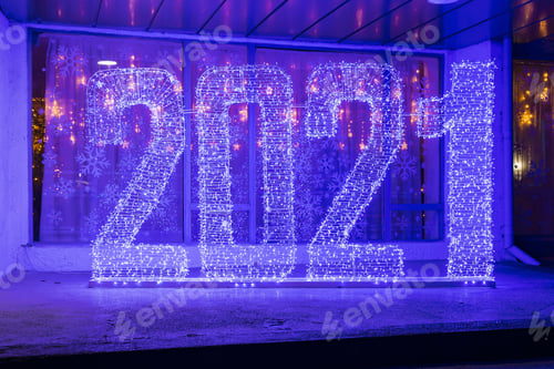 Preview: Inscription of 2021 Made With A Garland In A Cold Tone On The Street In An Urban Environment. Abstract