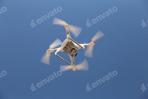 Preview: White Quadrotor Helicopter Is Flying In Sky
