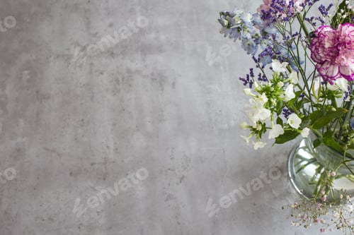 Preview: Beautiful Bouquet Spring Pink Flowers On Grey Cement Table Top View. With Vase Modern Home