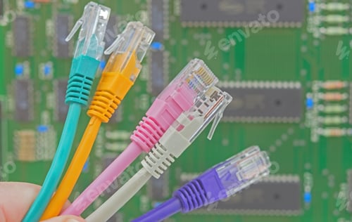 Preview: Multicolored Network Connector Wires On Background Electronic Circuit Board