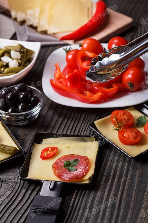 Preview: Young Woman Is Preparing A Traditional Swiss Cheese Raclette