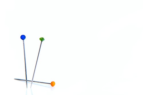 Preview: Two Standing And One Pin Lying On A White Background