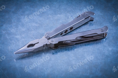 Preview: Muunctional Stainless Jackknife On Scratched Metallic Background.