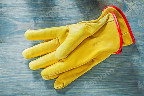 Preview: Pair Of Working Gloves On Wooden Board Construction Concept.