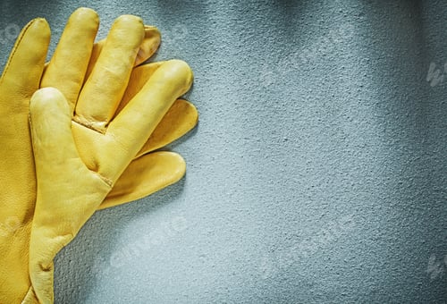 Preview: Leather Protective Gloves On Concrete Surface Construction Concept.