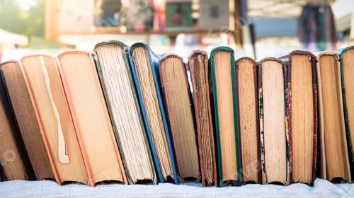 Preview: Detail Of Old Books Aligned In A Row On Market Stall Old Fashioned