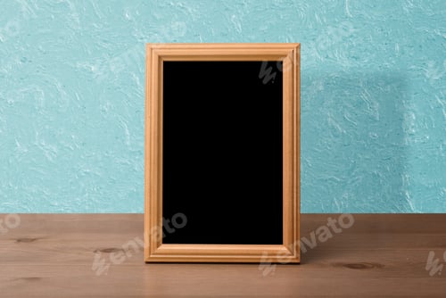 Preview: Wooden Photo Frame On Table, Blue Wall