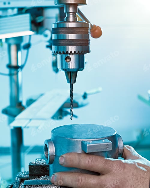 Preview: A Closeup Of A Worker Installing A Metal Part For Drilling Holes In An Engineering Plant.
