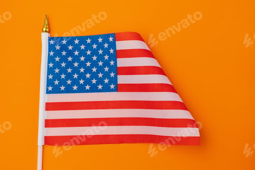 Preview: American Flag Waving on a Vibrant Orange Background