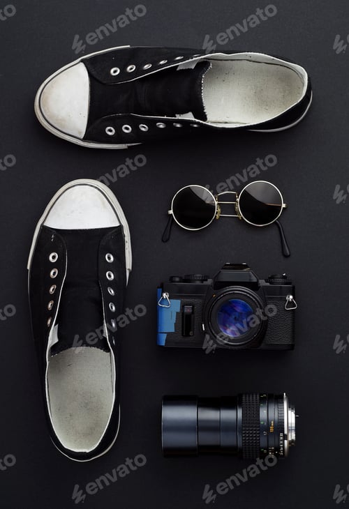 Preview: Concept: Ready For A Trip. Sneakers, Photo Camera, And Round Sunglasses Well Organized Over Black
