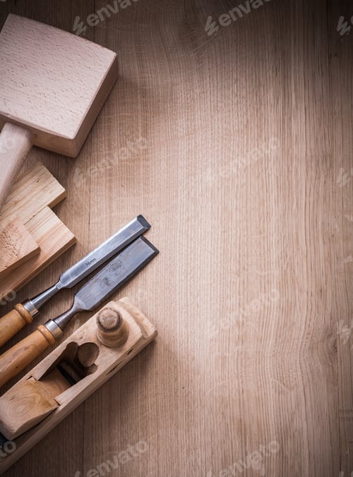 Preview: Vertical View Of Lump Hammer Shaving Plane Metal Chisels And Wooden Planks On Wood Board
