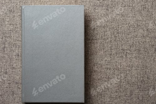 Preview: Gray Book On The Sofa With Place For An Inscription Or Text