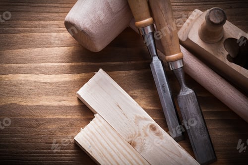 Preview: Wooden Mallet Planner Chisels Building Planks On Wood Board Construction Concept.