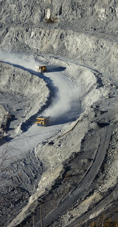 Preview: Two Mining Trucks Rushing At High Speed Along A Dusty Road In A Limestone Quarry, Top View