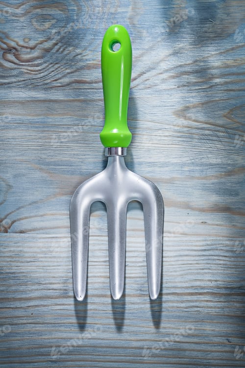 Preview: Stainless Trowel Fork On Wooden Board Top View Gardening Concept.
