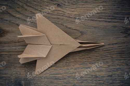 Preview: Origami Paper Airplane Mockup. Selective Focus. Dark Wooden Background.