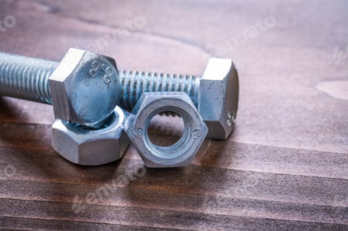 Preview: Bolt Details And Screw Nuts On Vintage Brown Wooden Board Maintenance Concept