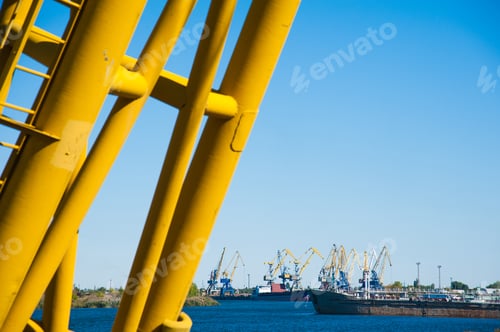 Preview: Loading In Port. Floating Port Crane On Blue Sky Background. Chains And Hooks Hoist With Slings For