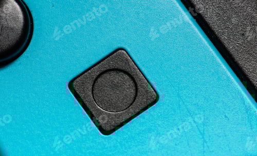 Preview: A Black Square Button On A Blue Hand Controller