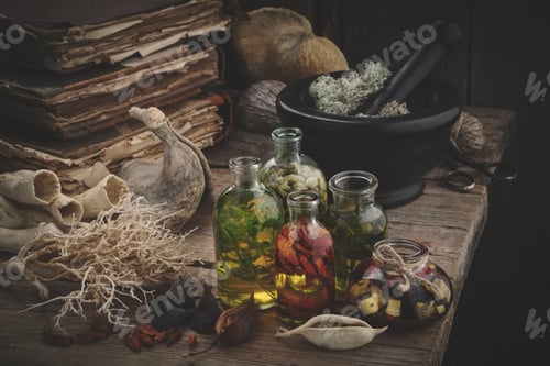 Preview: Bottles Of Essential Oil, Mortar Of Dried Moss, Old Books, Dry Roots And Plants. Herbal Medicine.
