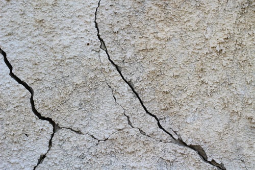 Preview: Cracked Concrete Texture Background. Grey Surface With Cracks Close Up. A Lot Of Pieces Of