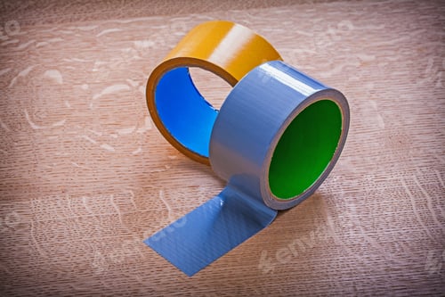 Preview: Close Up Of Adhesive Tapes On Brown Wood Board Maintenance Concept