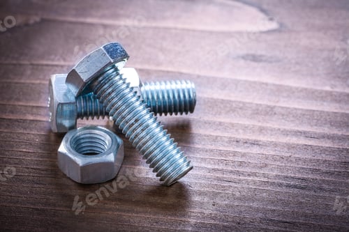 Preview: Vintage Brown Wood Board With Couple Of Metal Bolts And Nuts Maintenance Concept