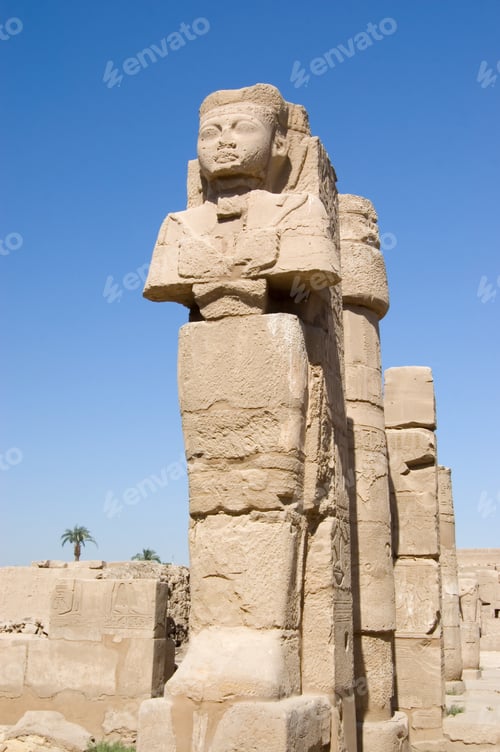 Preview: Ancient Pharaoh Statue And Column On Backlighted Sky Background