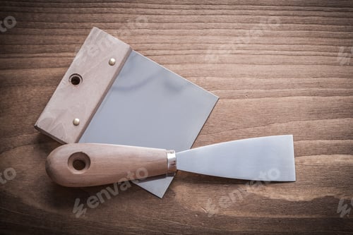 Preview: Putty Spattle And Paint Scraper On Wood Board.