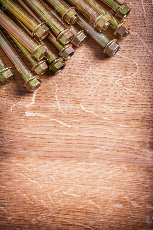 Preview: Anchors For Concrete Wall On Wooden Board With Organized Copyspace