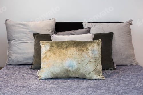 Preview: Bed Maid-Up With Clean White Pillows And Bed Sheets In Beauty Room. Close-Up. Lens Flair In