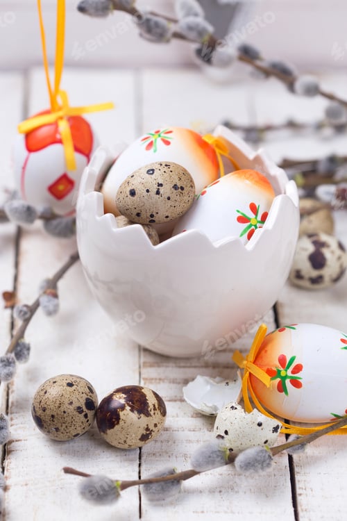 Preview: Decorative Easter Eggs In Bowl And Willow Branches On Wooden Background. Easter