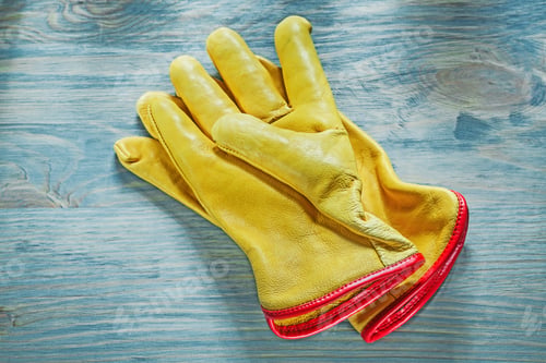 Preview: Leather Working Gloves On Wooden Board Top View Construction Concept.