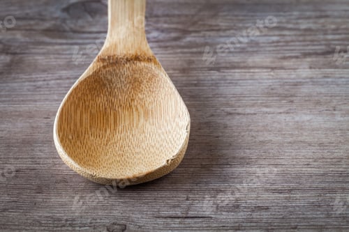 Preview: Empty Spoon On A Wooden Background