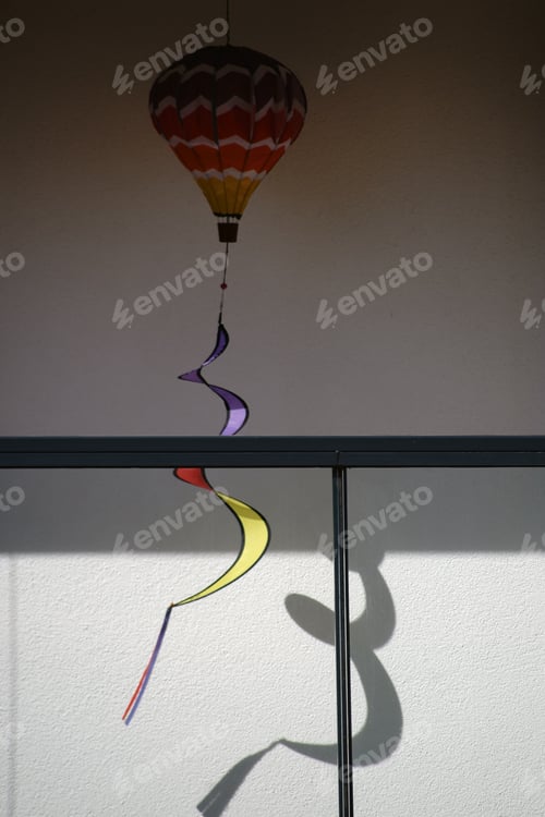 Preview: A Lantern With A Rotating Tail In The Corner Of A Balcony.
