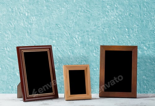 Preview: Wooden Photo Frames On Table, Blue Wall